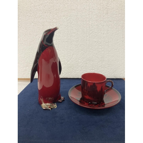 703 - A ROYAL DOULTON FLAMBE CUP AND SAUCER-  6 CM
A ROYAL DOULTON FLAMBE PENGUIN AF - DAMAGE TO BEAK AND ... 