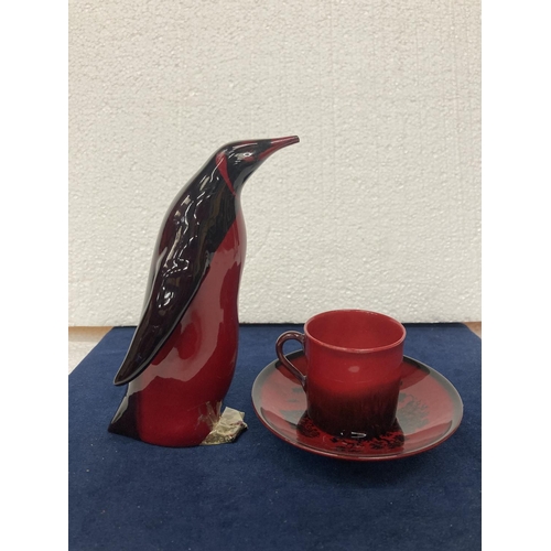 703 - A ROYAL DOULTON FLAMBE CUP AND SAUCER-  6 CM
A ROYAL DOULTON FLAMBE PENGUIN AF - DAMAGE TO BEAK AND ... 