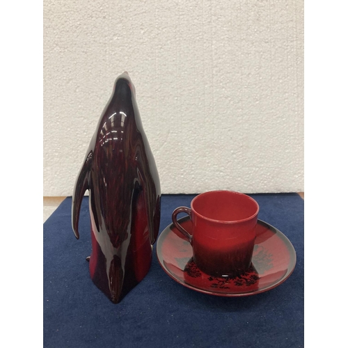 703 - A ROYAL DOULTON FLAMBE CUP AND SAUCER-  6 CM
A ROYAL DOULTON FLAMBE PENGUIN AF - DAMAGE TO BEAK AND ... 