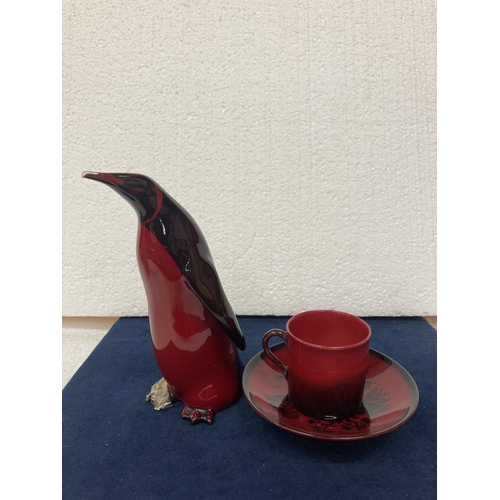 703 - A ROYAL DOULTON FLAMBE CUP AND SAUCER-  6 CM
A ROYAL DOULTON FLAMBE PENGUIN AF - DAMAGE TO BEAK AND ... 