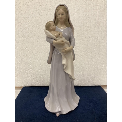 704 - A LEONARDO COLLECTION FIGURINE OF A NUN WITH CHILD - 27 CM