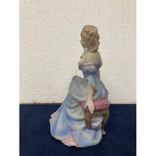 720 - A COALPORT HAND DECORATED PORCELAIN FIGURINE WITH A MATT FINISH - AGE OF ELEGANCE 