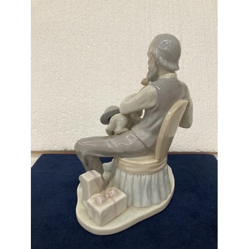 725 - A PORCELAIN FIGURINE OF A GENTLEMAN WITH DOG SMOKING A PIPE WHILST READING THE NEWSPAPER - SMALL CHI... 