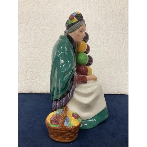 728 - A ROYAL DOULTON FIGURINE OF THE OLD BALLOON SELLER HN 1315 - HAND MADE AND HAND DECORATED - 19.5 CM