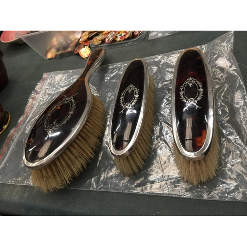 80 - THREE HALLMARKED LONDON SILVER RIMMED BRUSHES WITH TORTOISESHELL STYLE BACKS