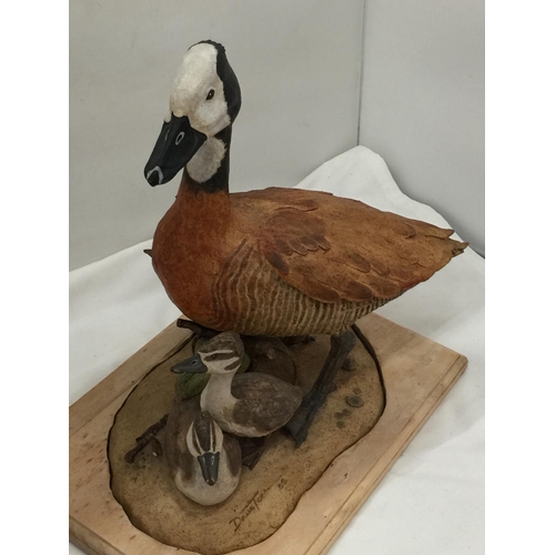 94 - A DAVID TOMLINSON CERAMIC WHITE FACED DUCK WITH DUCKLINGS, SIGNED TO THE BASE, HEIGHT APPROX 31CM, L... 