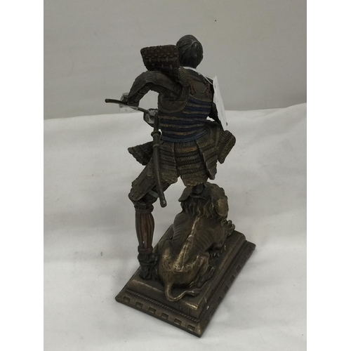 97 - A METAL FIGURE OF A SAMURAI WARRIOR STANDING ON A LION HEIGHT 24CM