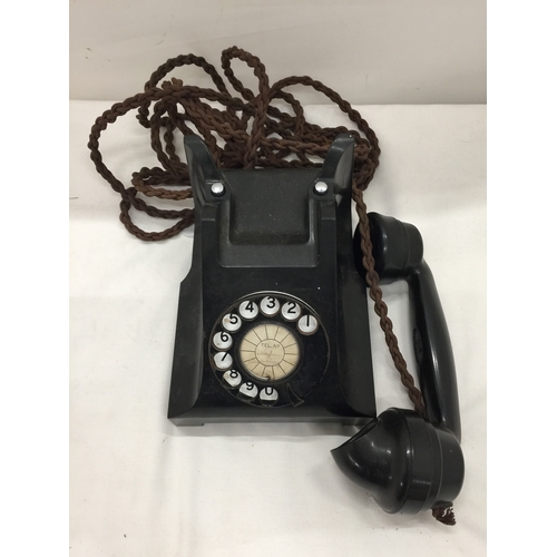 139 - A VINTAGE BLACK BAKELITE TELEPHONE WITH FRONT DIAL - MISSING FRONT TRAY