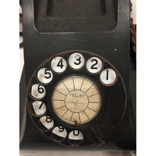 139 - A VINTAGE BLACK BAKELITE TELEPHONE WITH FRONT DIAL - MISSING FRONT TRAY