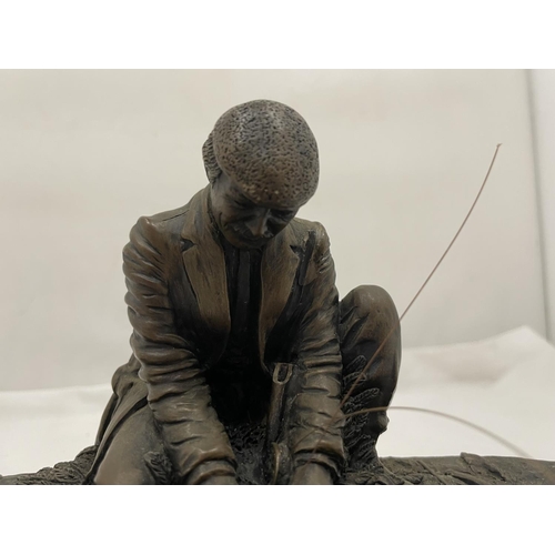 31 - A CROUCHING MAN FISHING WITH ROD ON A WOODEN PLINTH W: 28CM