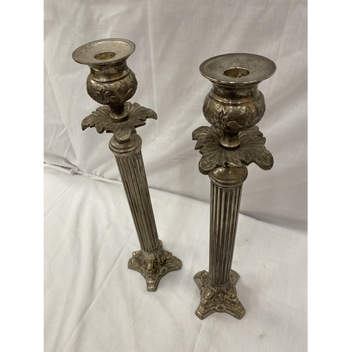 48 - A PAIR OF SILVER PLATED CANDLESTICKS WITH COLUMN DECORATION HEIGHT 45.5CM