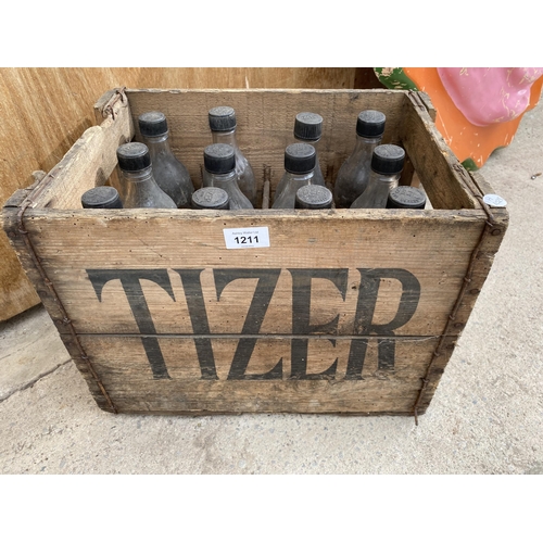 1211 - A VINTAGE WOODEN MONOGRAMED TIZER CRATE CONTAINING 12 VINTAGE GLASS TIZER BOTTLES