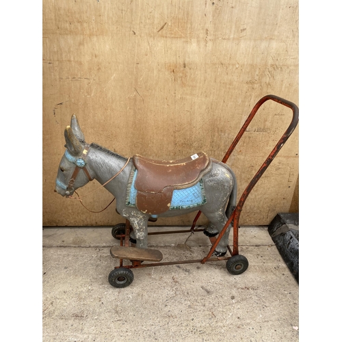 1214 - A VINTAGE 1950'S TRIANG PUSH ALONG DONKEY