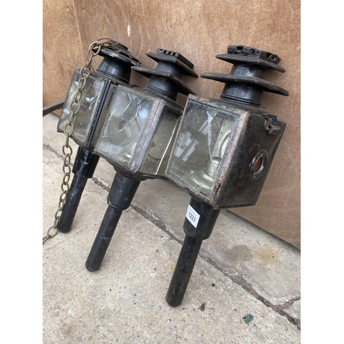 1223 - THREE VINTAGE PARAFIN POWERED COACH LAMPS