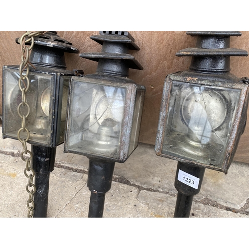 1223 - THREE VINTAGE PARAFIN POWERED COACH LAMPS