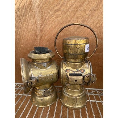 1230 - A NEAR PAIR OF VINTAGE BRASS PARAFIN LAMPS