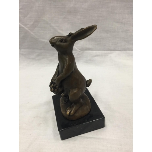 13 - A SMALL BRONZE OF A RABBIT HOLDING FLOWERS ON MARBLE BASE SIGNED MILO H: 14CM