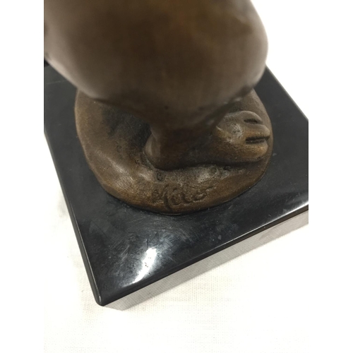 13 - A SMALL BRONZE OF A RABBIT HOLDING FLOWERS ON MARBLE BASE SIGNED MILO H: 14CM