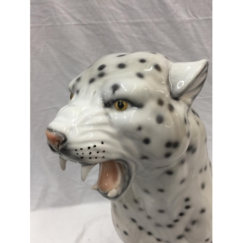 14 - A VERY LARGE ITALIAN MADE CERAMIC SNOW LEOPARD INSCRIBED WITH INDISTINCT SIGNATURE TO BASE, HAS SOME... 