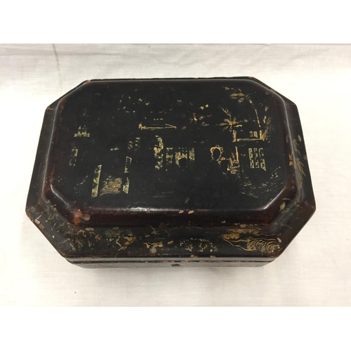 16 - A CHINOISERIE DECORATED SARCOPHAGUS SHAPED BOX WITH ORIENTAL STYLING