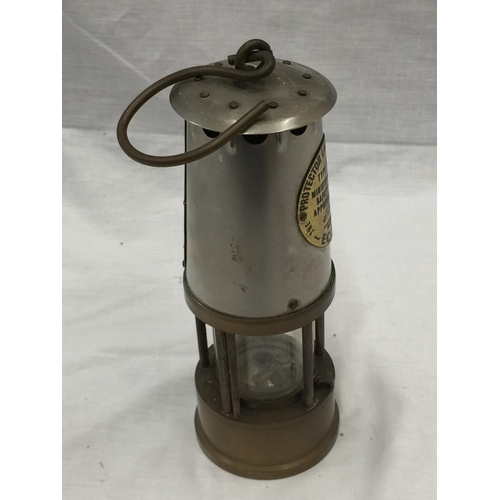 24 - A VINTAGE ECCLES BRASS PROTECTOR LAMP H: 23CM