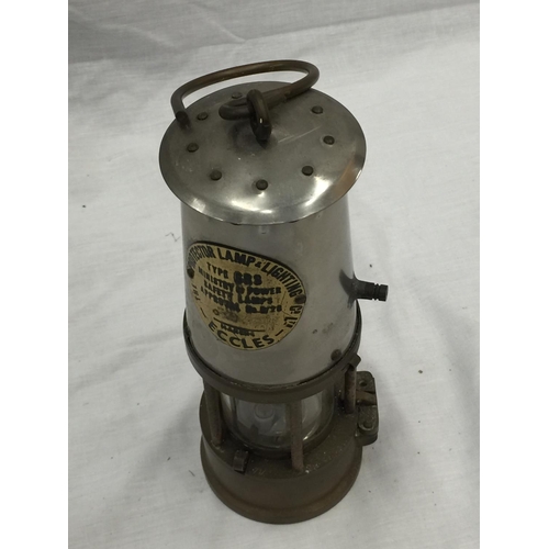 24 - A VINTAGE ECCLES BRASS PROTECTOR LAMP H: 23CM