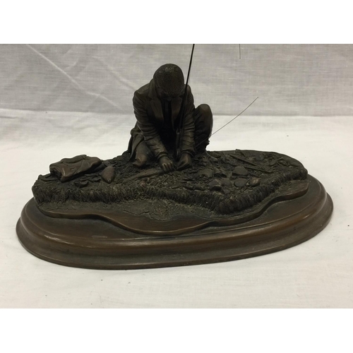 31 - A CROUCHING MAN FISHING WITH ROD ON A WOODEN PLINTH W: 28CM