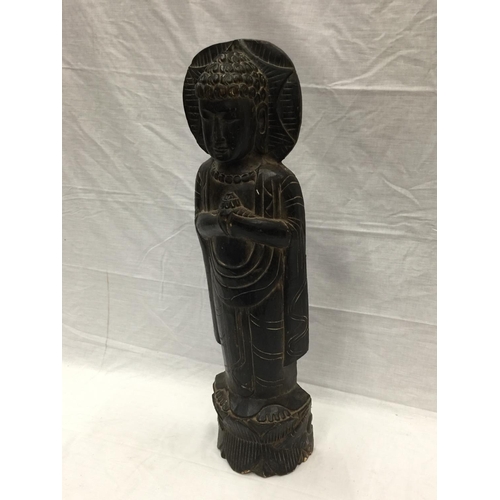 32 - AN ASIAN WOOD CARVING OF A BUDDHIST STYLE PRAYING FIGURE H: 66CM