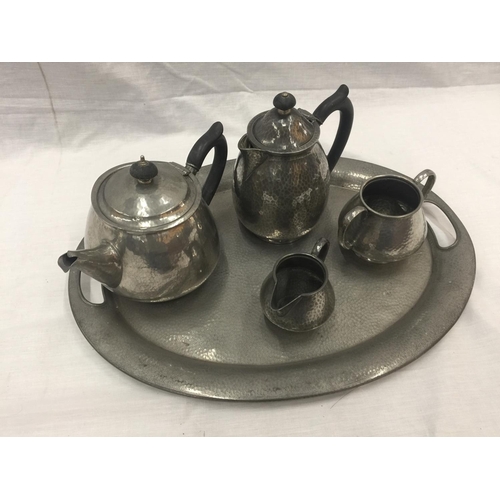 6 - A HAND HAMMERED SIX PIECE TUDRIC PEWTER SET