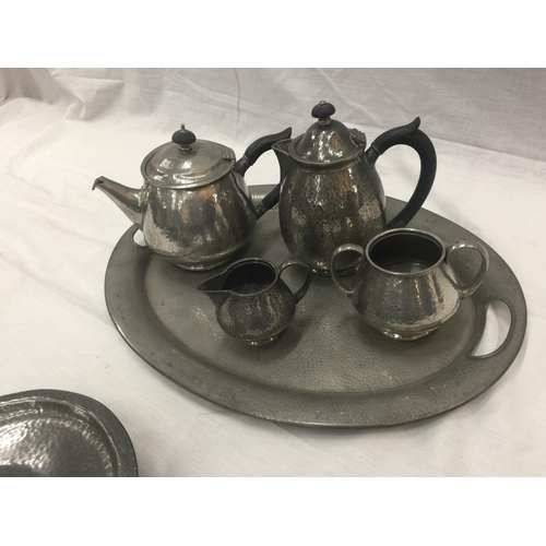 6 - A HAND HAMMERED SIX PIECE TUDRIC PEWTER SET