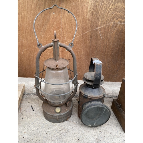 1255 - A VINTAGE ROAD LAMP AND A VINTAGE PARAFIN LAMP