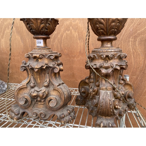 1259 - A PAIR OF HIGHLY DECORATIVE WOODEN CARVED TABLE LAMPS