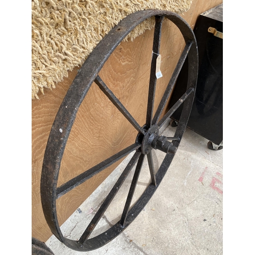 1285 - A VINTAGE CAST IRON CART WHEEL