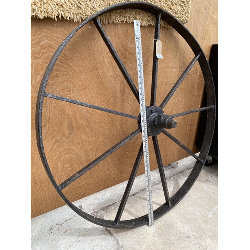 1285 - A VINTAGE CAST IRON CART WHEEL