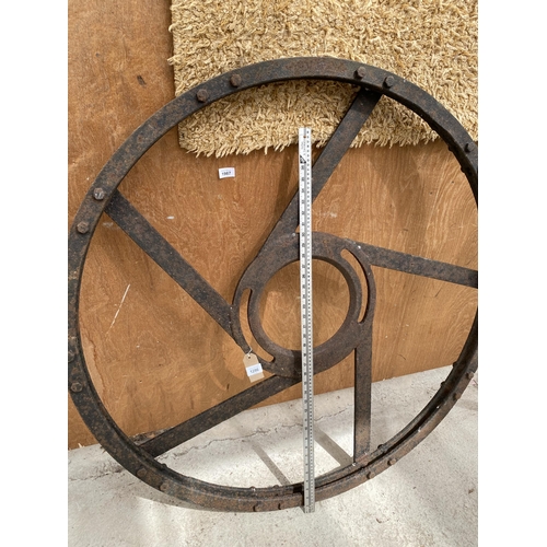 1286 - A LARGE VINTAGE CAST IRON IMPLEMENT WHEEL