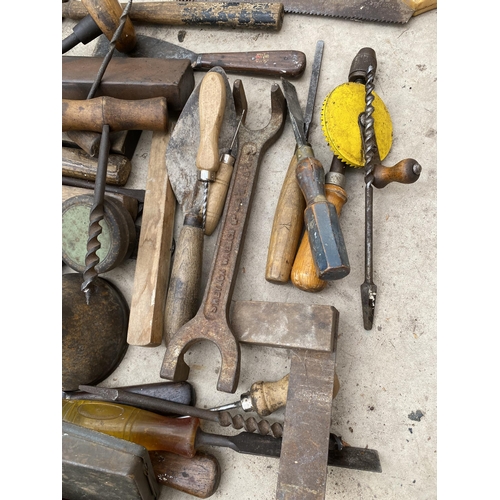 1302 - AN ASSORTMENT OF TOOLS TO INCLUDE HAMMERS, SPANNERS AND SHARPENING STONES ETC