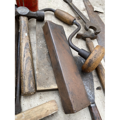 1302 - AN ASSORTMENT OF TOOLS TO INCLUDE HAMMERS, SPANNERS AND SHARPENING STONES ETC