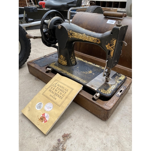 1308 - A VINTAGE SINGER SEWING MACHINE WITH WOODEN CARRY CASE