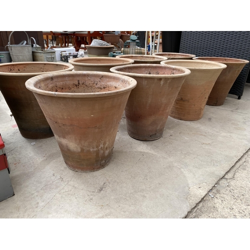 1318 - A COLLECTION OF EIGHT LARGE TERRACOTTA GARDEN POTS