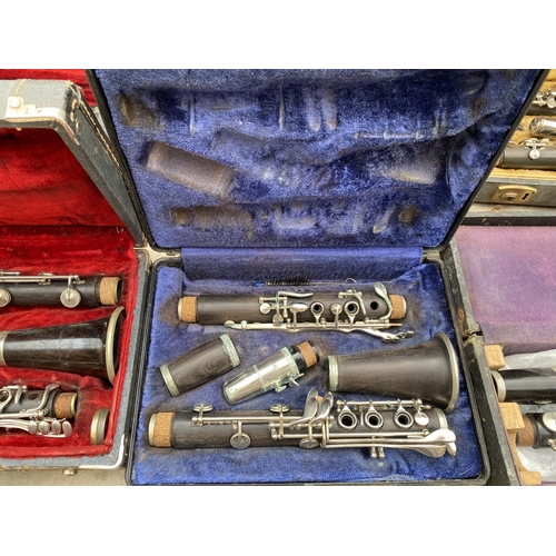 1320 - A COLLECTION OF TEN VINTAGE CASED CLARINETS