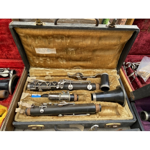 1320 - A COLLECTION OF TEN VINTAGE CASED CLARINETS