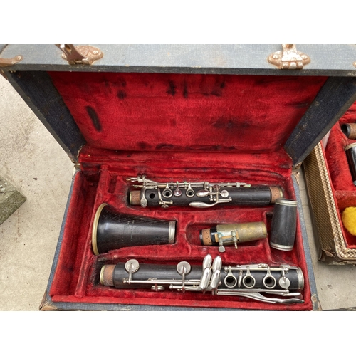 1320 - A COLLECTION OF TEN VINTAGE CASED CLARINETS