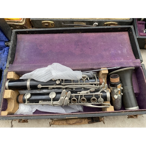 1320 - A COLLECTION OF TEN VINTAGE CASED CLARINETS