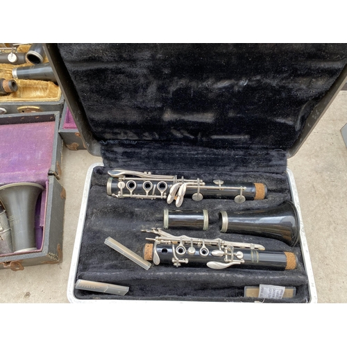 1320 - A COLLECTION OF TEN VINTAGE CASED CLARINETS