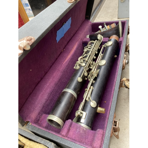 1320 - A COLLECTION OF TEN VINTAGE CASED CLARINETS