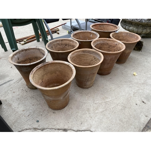 1323 - A COLLECTION OF EIGHT LARGE TERRACOTTA GARDEN POTS