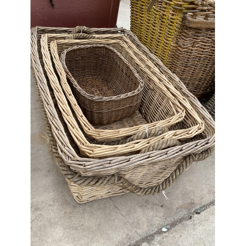 1343 - AN ASSORTMENT OF LARGE WICKER BASKETS TO INCLUDE A LARGE LOG BASKET ETC