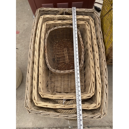 1343 - AN ASSORTMENT OF LARGE WICKER BASKETS TO INCLUDE A LARGE LOG BASKET ETC