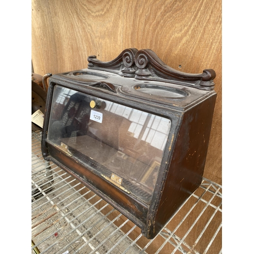 1239 - A VINTAGE WOODEN CIGAR CABINET WITH HINGED FRONT DOOR