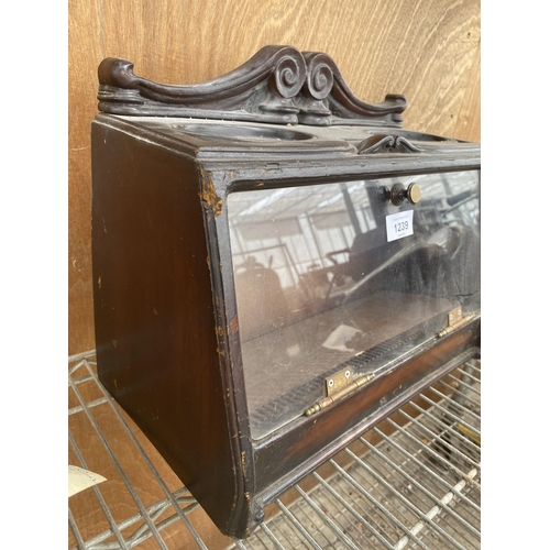 1239 - A VINTAGE WOODEN CIGAR CABINET WITH HINGED FRONT DOOR